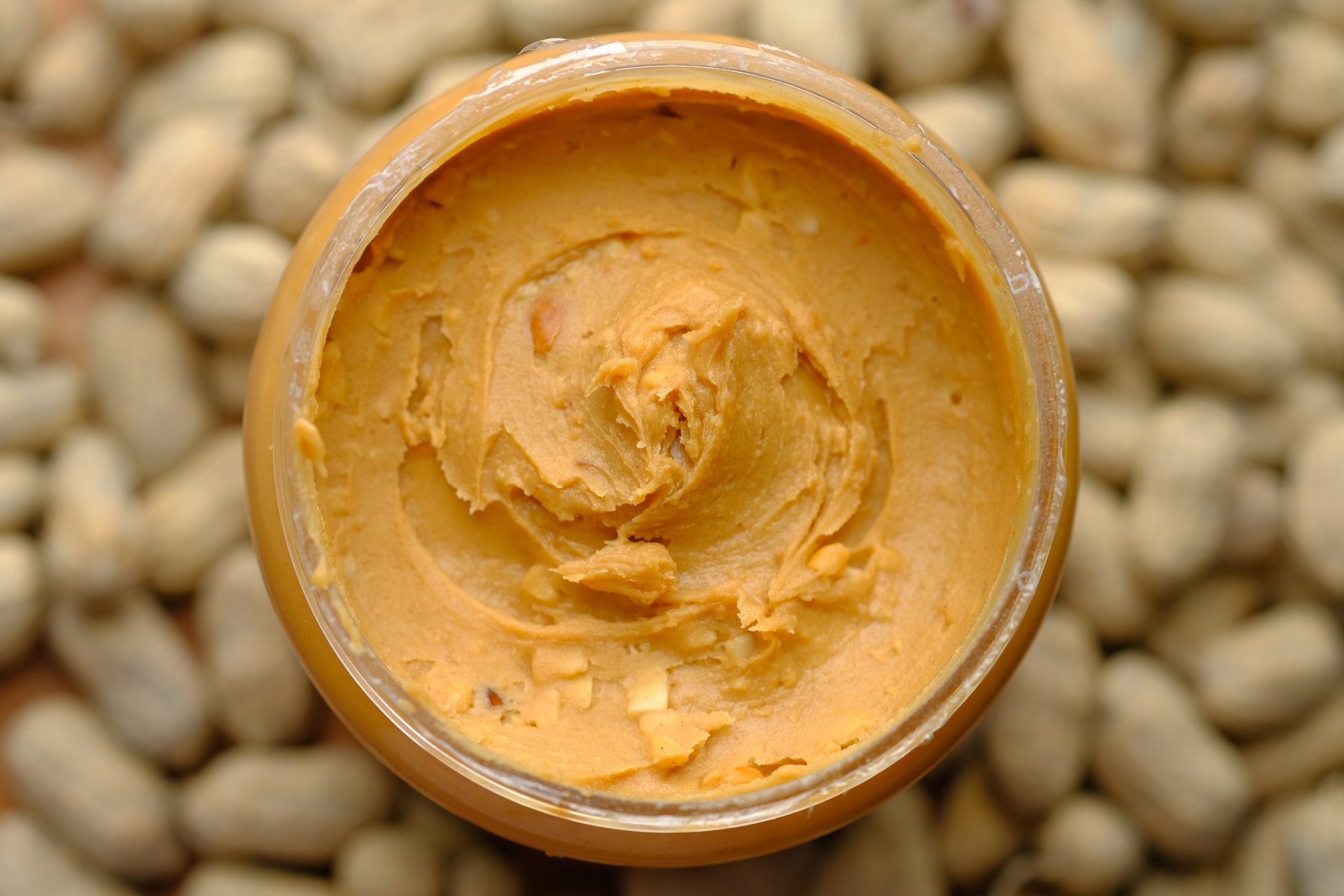 An open can of creamy peanut butter